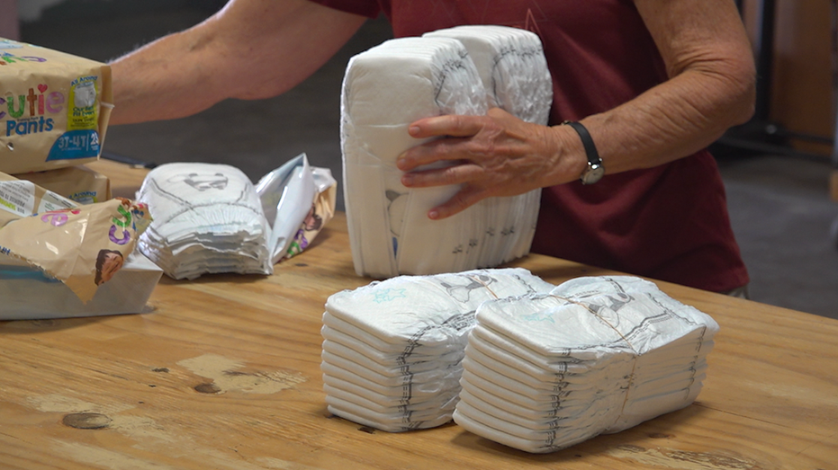 Volunteer packing diapers