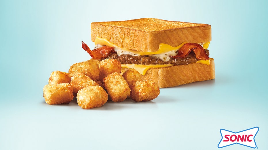 Sonic's Bacon Peppercorn Ranch Grilled Cheese Burger served with tater tots.