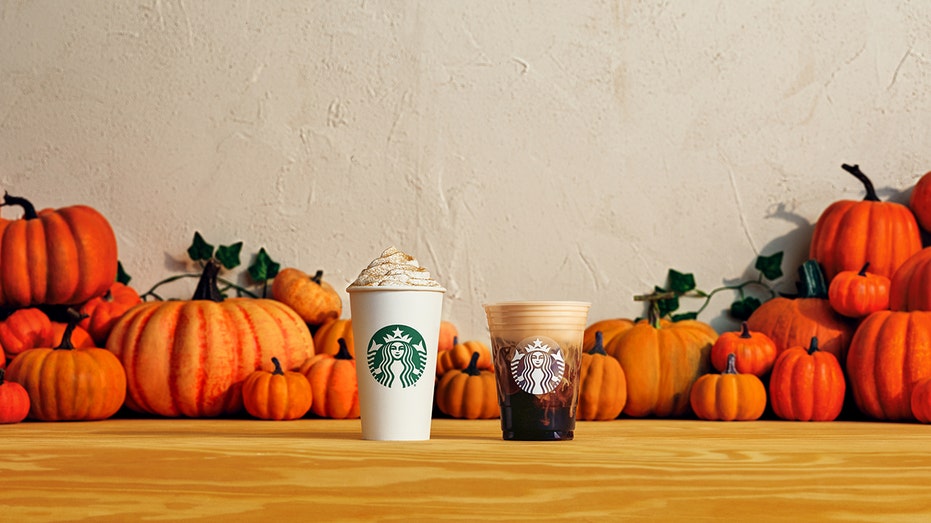 starbucks pumpkin beverages on a table