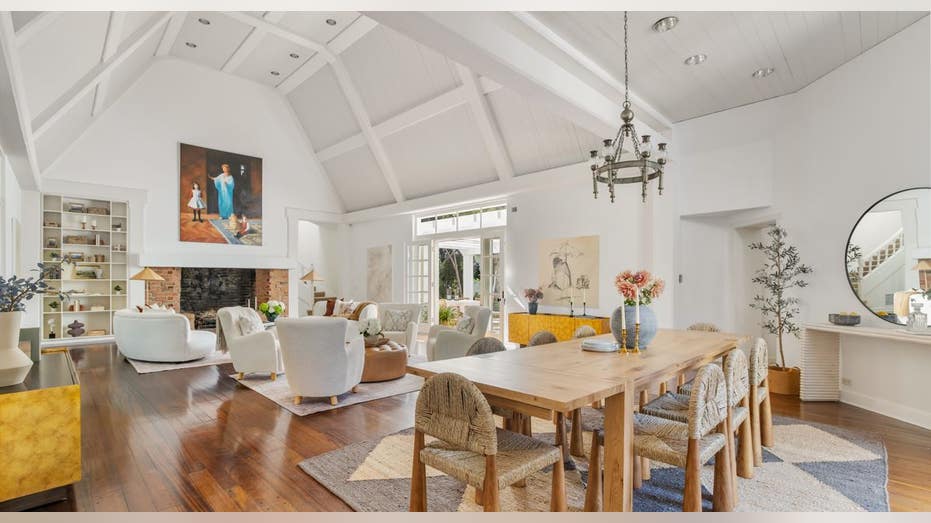 room with high ceilings chairs and a dining table