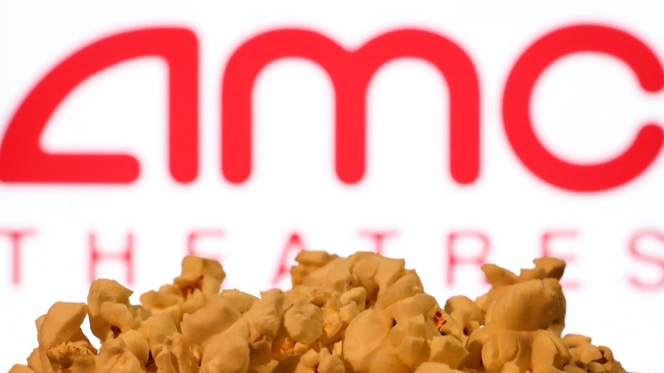 A bag of poporn with the AMC theaters logo in the background