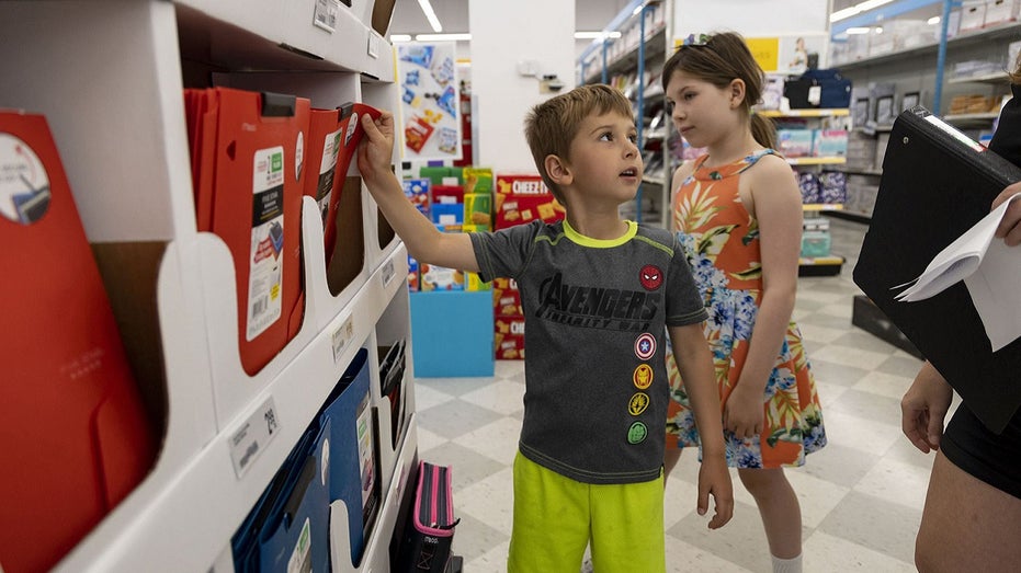 kids and parent shopping for school supplies