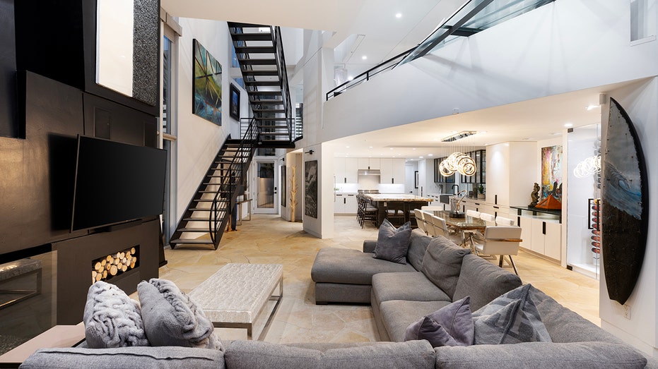 living room with stairs to second floor