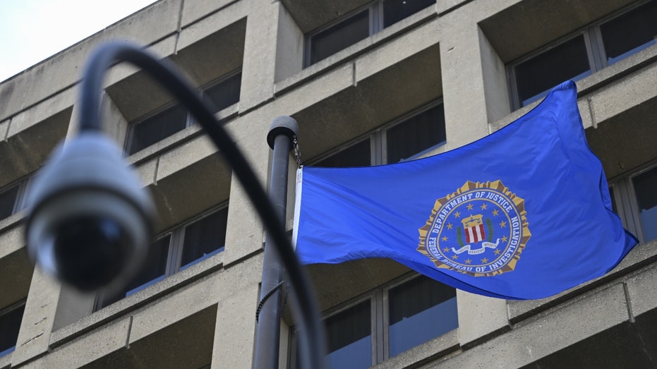 A flag and security camera at the Federal Bureau of Investigation headquarters building 