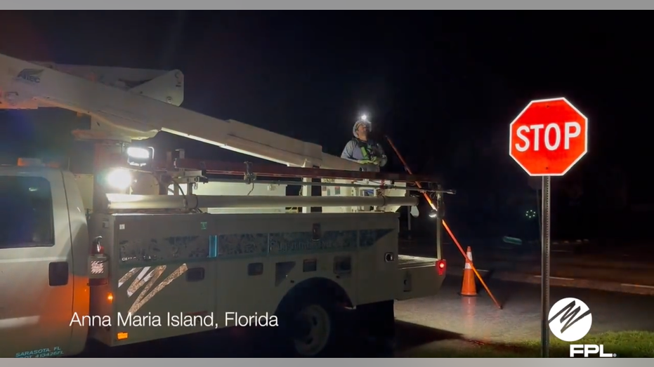 Power crews work during hurricane