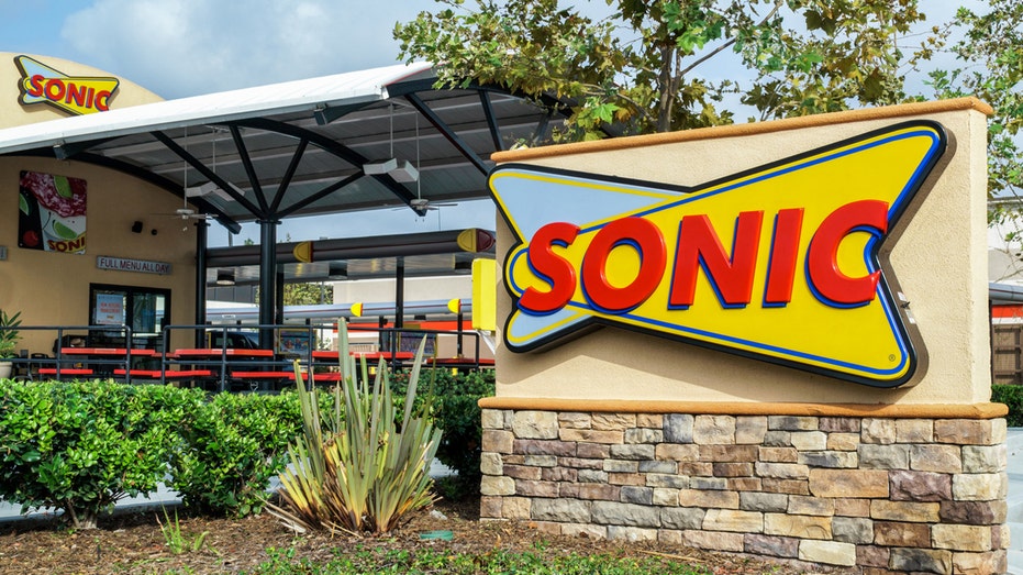 Sonic Drive-In Restaurant exterior in Costa Mesa, United States, with large logo sign.