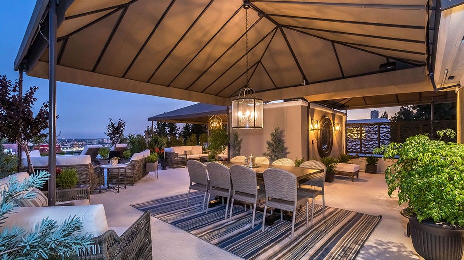 A dining table under the roof of the terrace in Liberace's former home