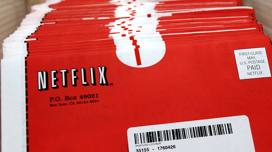 Netflix DVDs in iconic red and white envelopes
