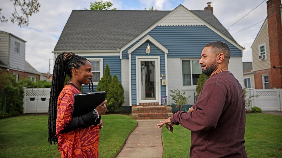 A real estate agent talking with a potential buyer