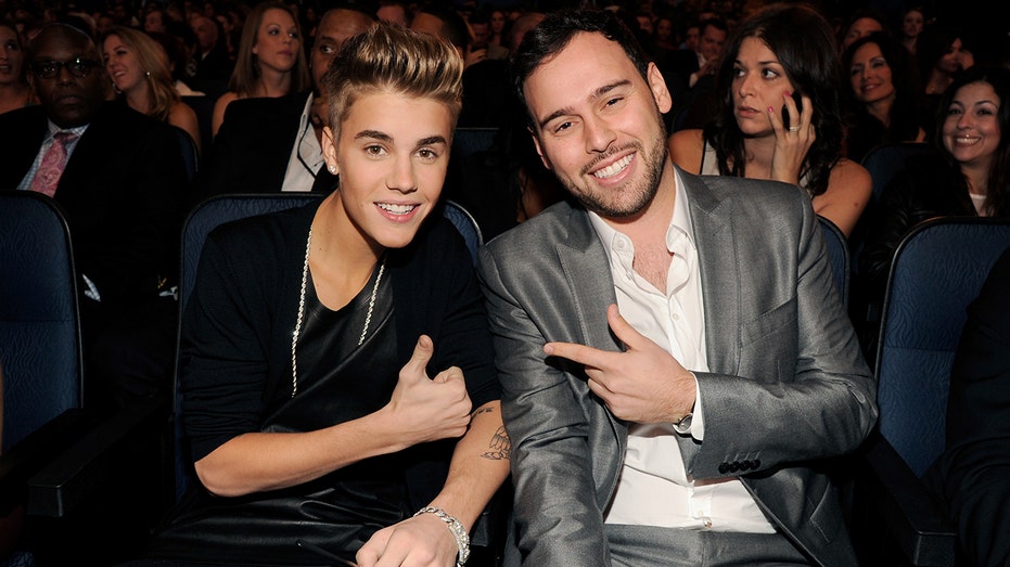 Justin Bieber and Scooter Braun attend MTV Awards in snazzy suits