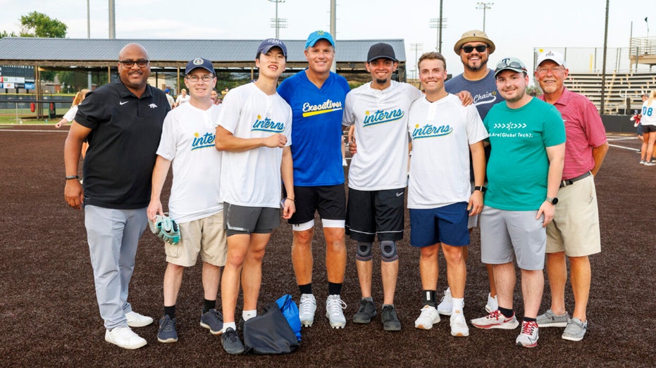 Walmart's Doug McMillon and others at softball game