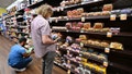 People shop for bread at a supermarket in Monterey Park, California on October 19, 2022. - Food prices in September rose 13% over last year, according to data released by the US government, as inflation raises prices to its highest levels in decades. 