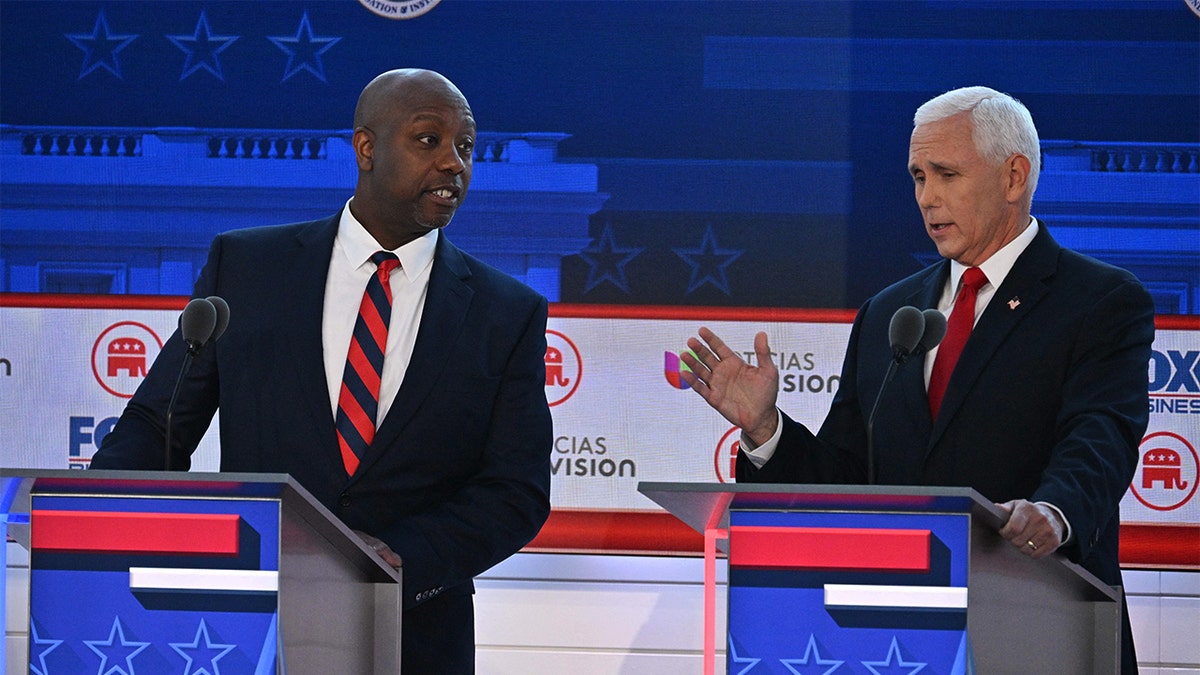 US Senator from South Carolina Tim Scott looks on as former US Vice President Mike Pence speaks during the second Republican presidential primary debate at the Ronald Reagan Presidential Library in Simi Valley, California, on September 27, 2023.