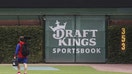 A DraftKings Sportsbook logo is posted on the right field wall of Chicago&apos;s Wrigley Field before a game between the Chicago Cubs and Philadelphia Phillies on Sept. 27, 2022. 
