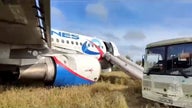 Ural Airlines flight makes emergency landing in a field in Russia after pilot feared running out of fuel