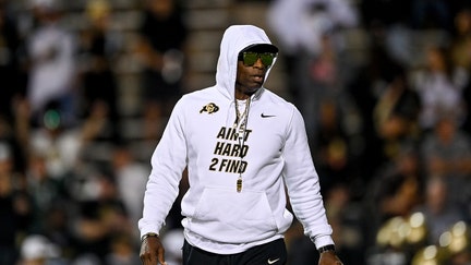 Head coach Deion Sanders of the Colorado Buffaloes walks on the field as players warm up before a game against the Colorado State Rams at Folsom Field on September 16, 2023 in Boulder, Colorado. 