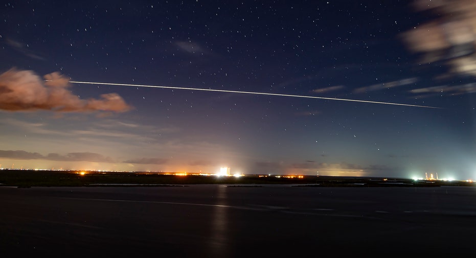 SpaceX capsule streak across sky