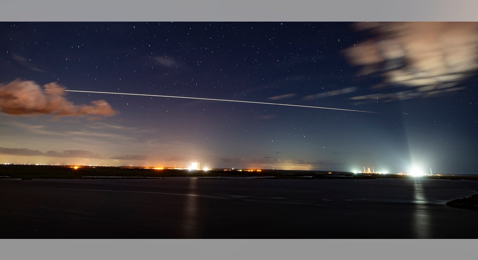 SpaceX capsule streak across sky