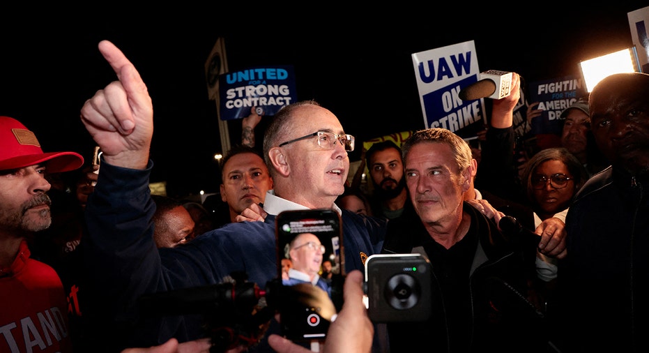 UAW president Shawn Fain speaks to reporters