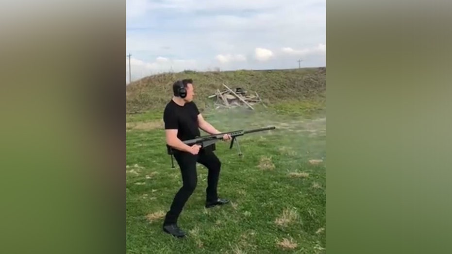 Elon Musk firing gun