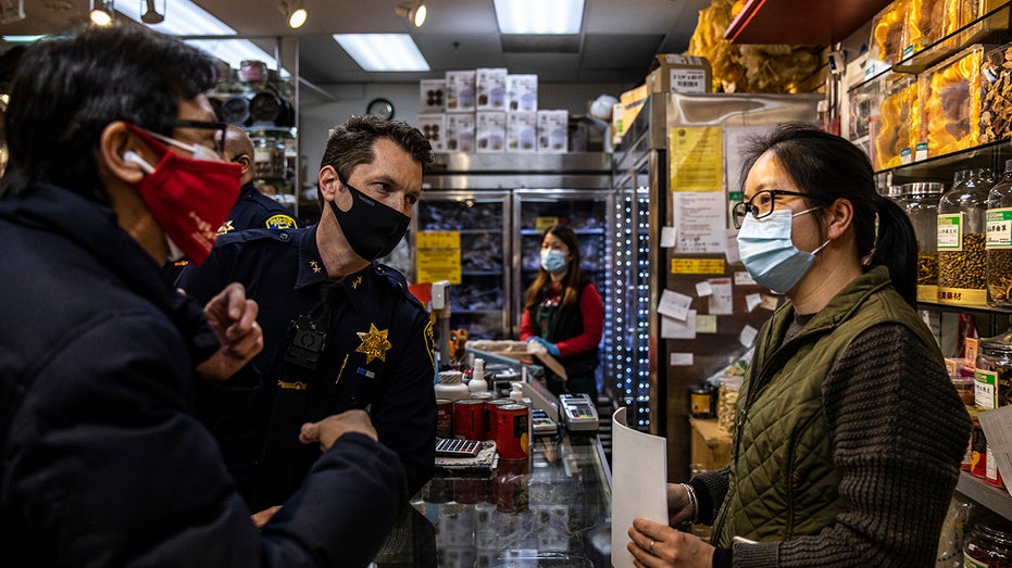 Chinatown leaders and police speak to business owner