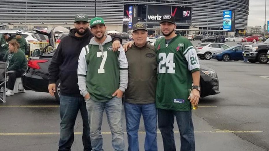 The Monge Family takes pictures with MetLife Stadium as backdrop