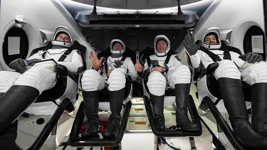 astronauts in capsule