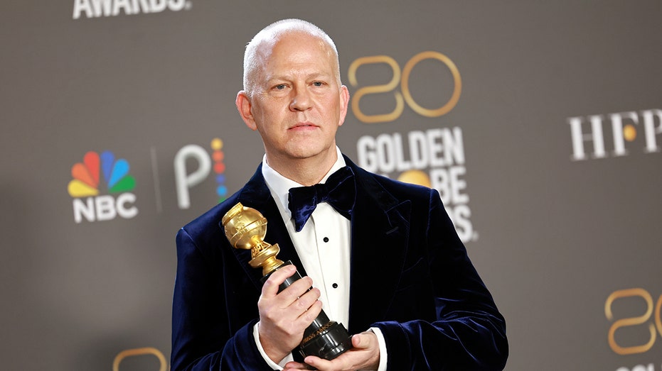 Close up of Ryan Murphy with a Golden Globe