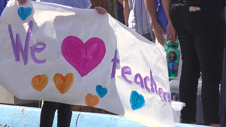 A poster states 'we love teachers.'