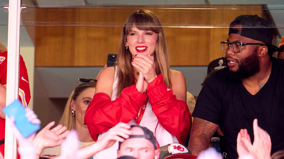 Taylor Swift cheers during a Kansas City Chiefs game