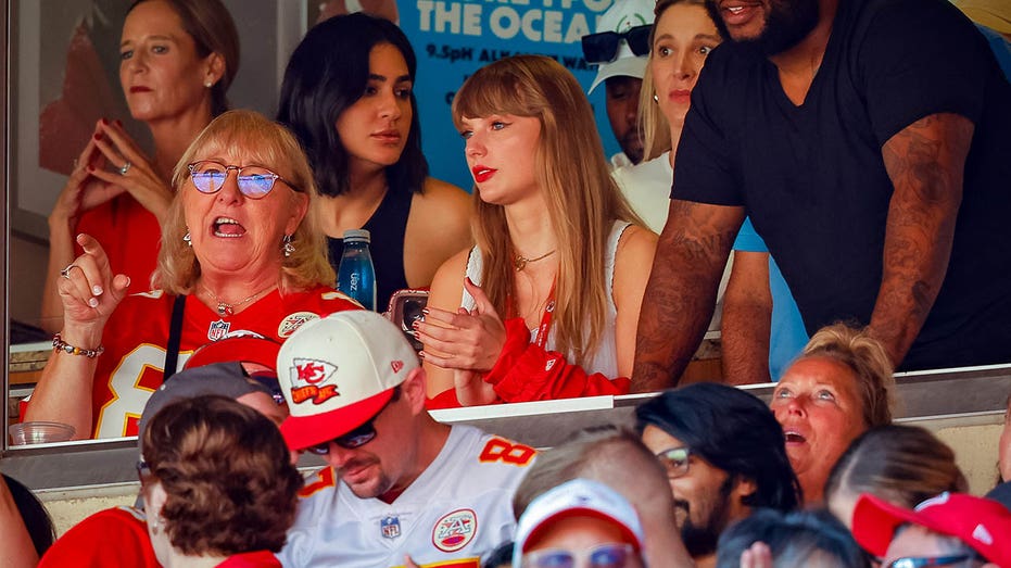 Taylor Swift watches an NFL game