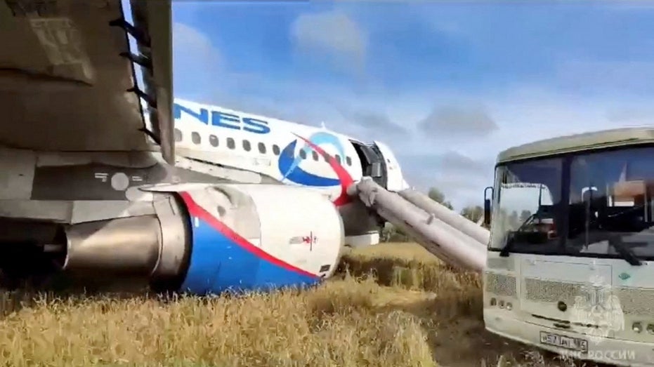 Russian plane lands in field