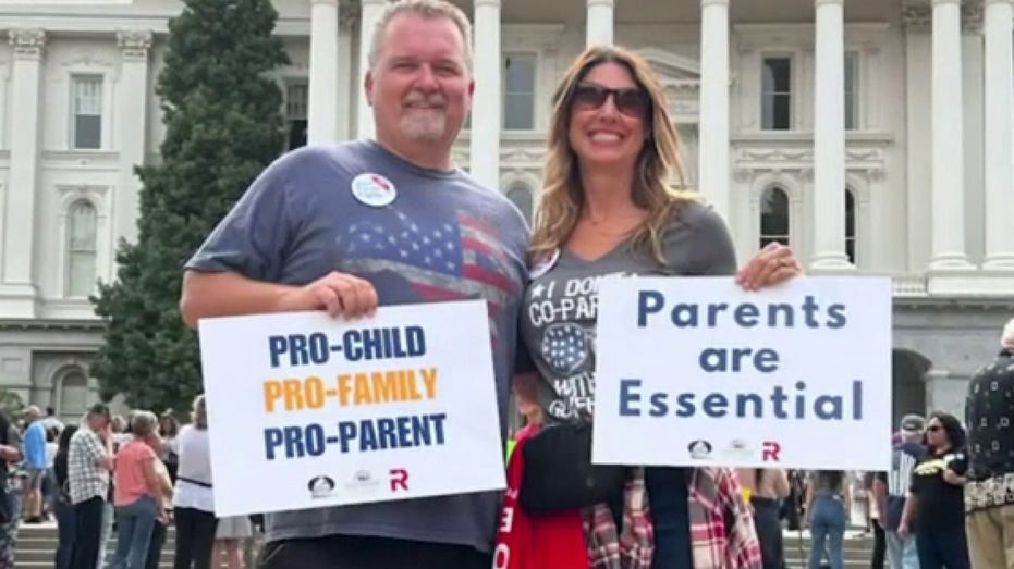 Man and woman protesting for parents