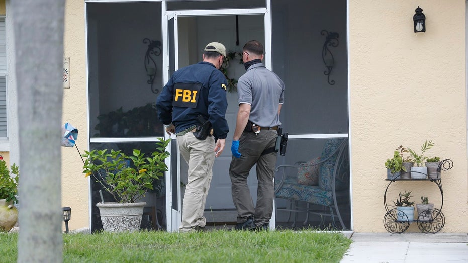 FBI agents search home