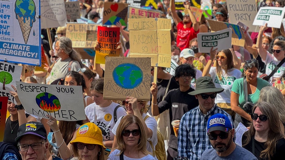 climate change protesters march in NYC