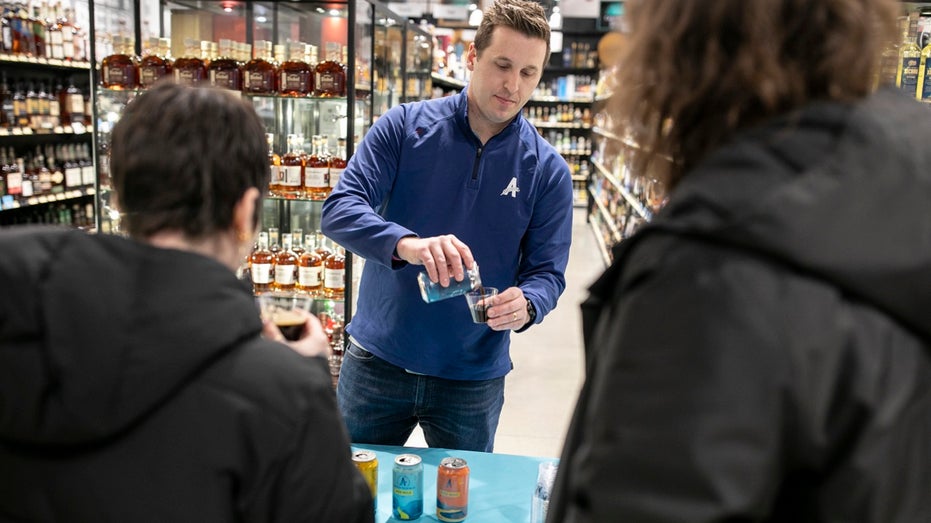 customers sampline NA beer in a store