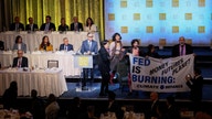 Fed Chair Powell escorted out of room as climate protesters interrupt start of speech