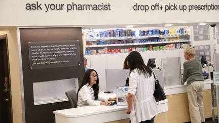 WHEELING, IL - SEPTEMBER 19:  Pharmacist Jeanie Kim (L) consults with a customer at a Walgreens pharmacy on September 19, 2013 in Wheeling, Illinois. Walgreens, the nation's largest drugstore chain, yesterday disclosed a plan to provide payments to roughly 160,000 eligible employees for the subsidized purchase of insurance beginning next year. The company says the plan will allow their employees to shop for coverage that best suits their needs through a private health-insurance marketplace.  (Photo by Scott Olson/Getty Images) - Fox Business News
