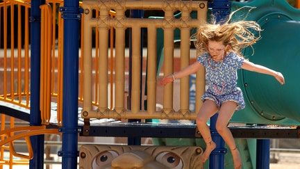 Harper Quinn, 6, who attends Mar Vista Elementary School, enjoys her day off at the Mar Vista Recreation Center in Los Angeles on Aug. 21, 2023. 