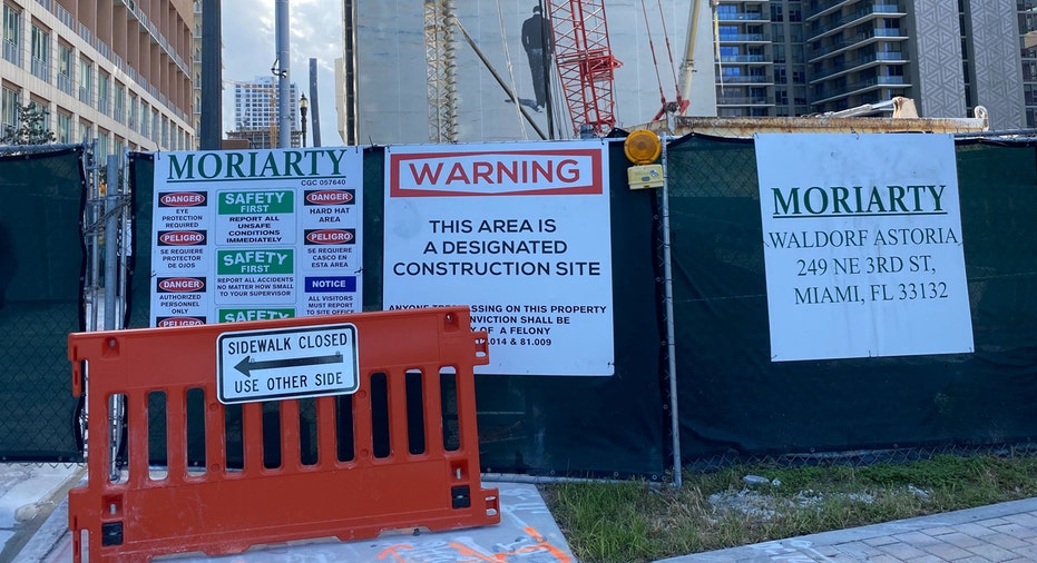 Waldorf Astoria Residences Miami construction site signs.