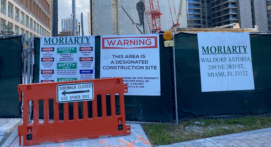 Waldorf Astoria Residences Miami construction site signs.