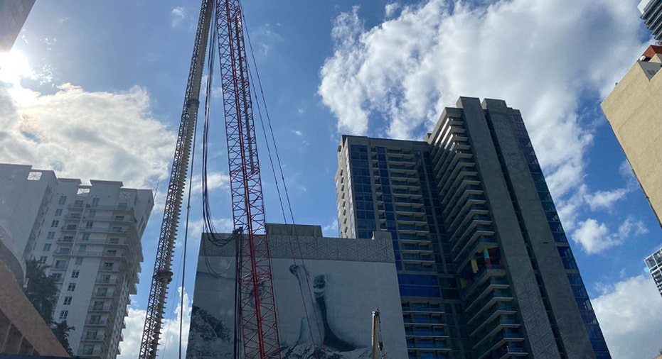 Waldorf Astoria Residences Miami crane in operation at construction site.