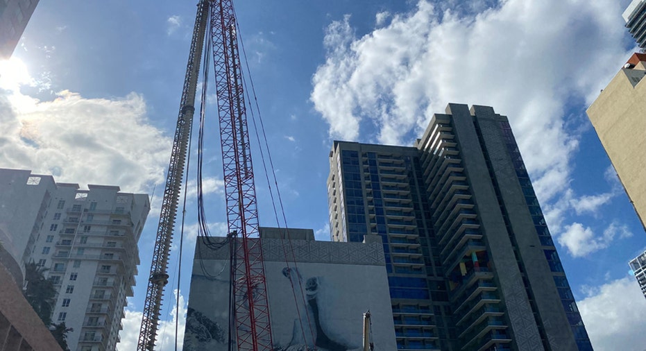 Waldorf Astoria Residences Miami crane in operation at construction site.