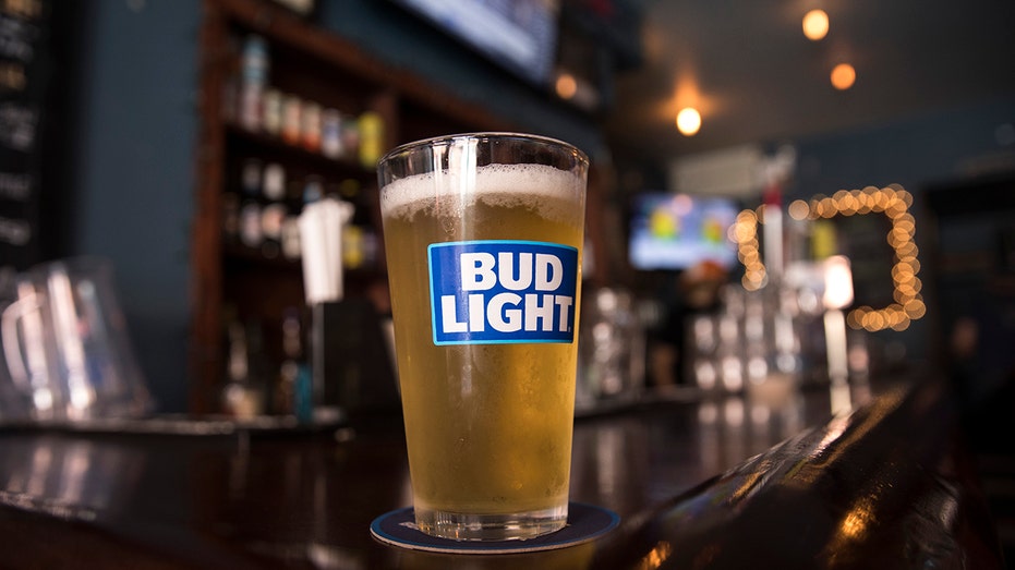 glass of bud light on a bar