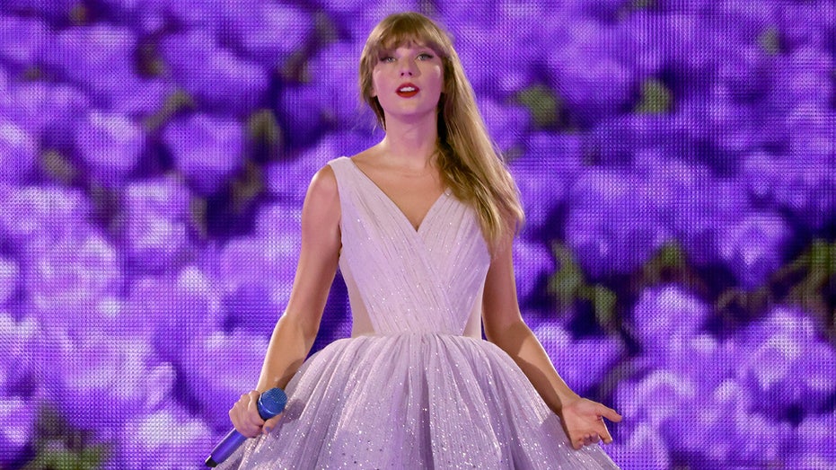 Taylor Swift with microphone onstage
