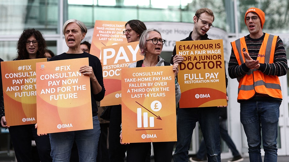 People standing with signs