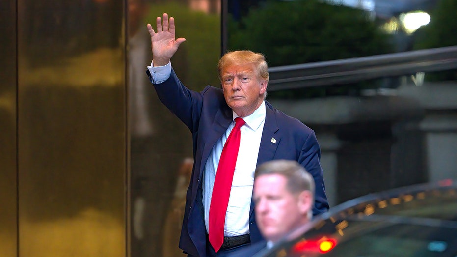 Trump waves to reporters in Manhattan