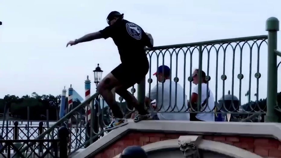 Man at Disney World's EPCOT is seen jumping into Lagoon