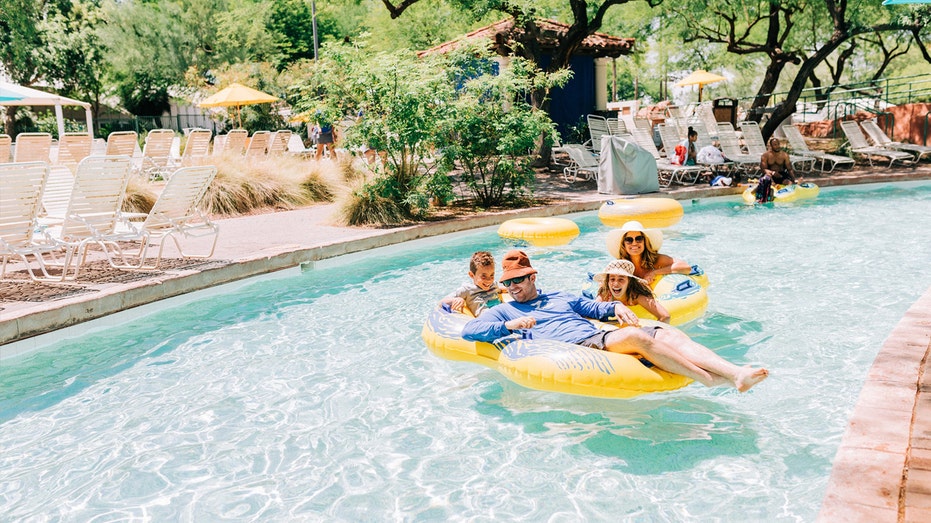 Family floats together in Arizona Grand pool.