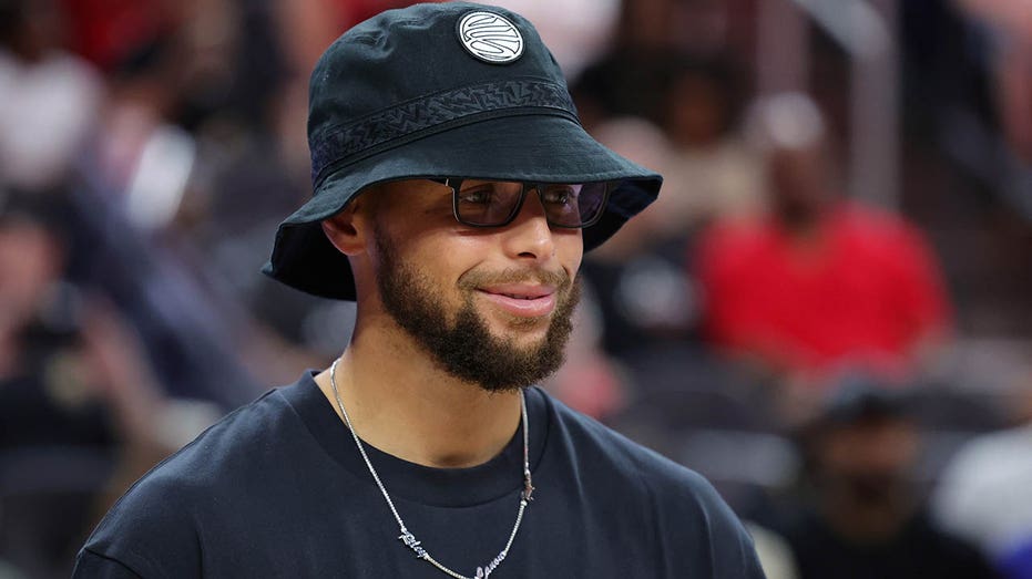 Stephen Curry at a WNBA game